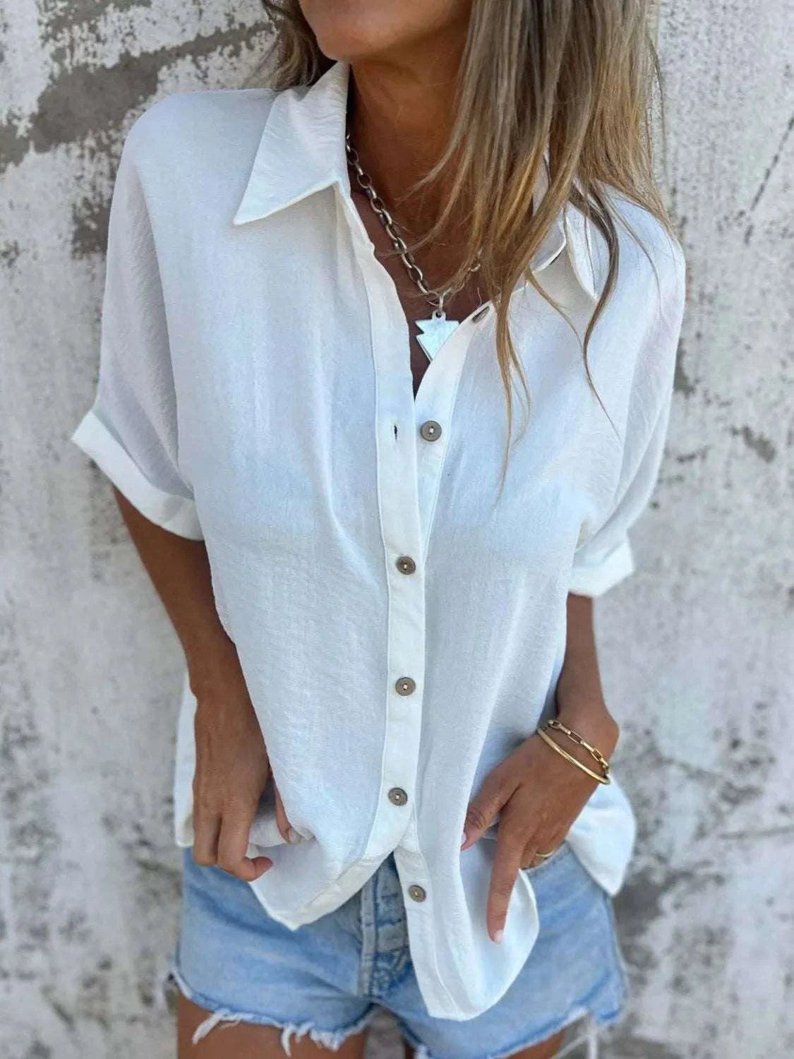 Full size collared neck half sleeve plus size shirt with buttoned front and no stretch polyester blend