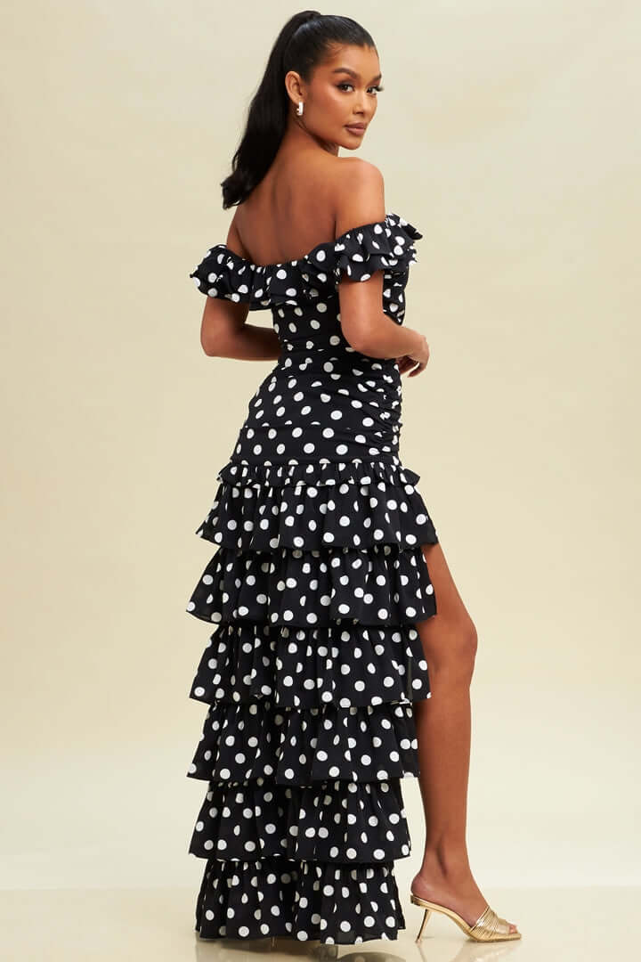 Black pretty woman wearing high low tiered polka dot dress