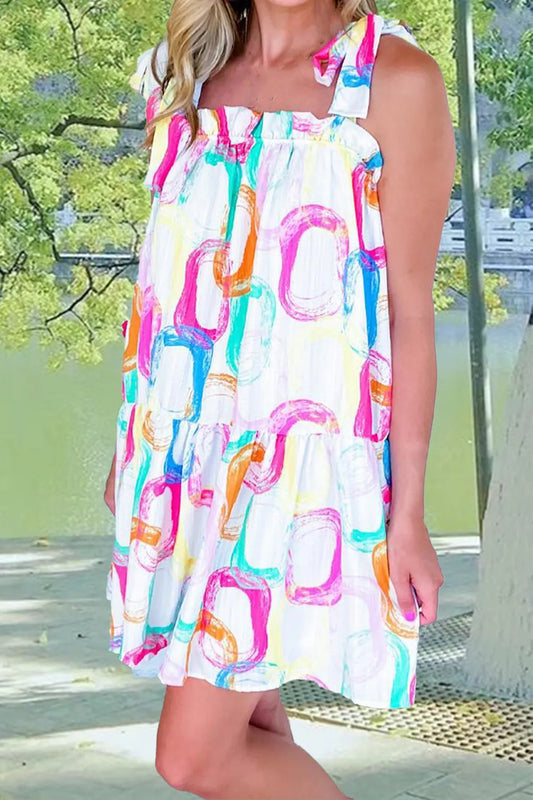Tied printed sleeveless mini dress made of 100% polyester with no stretch and machine washable