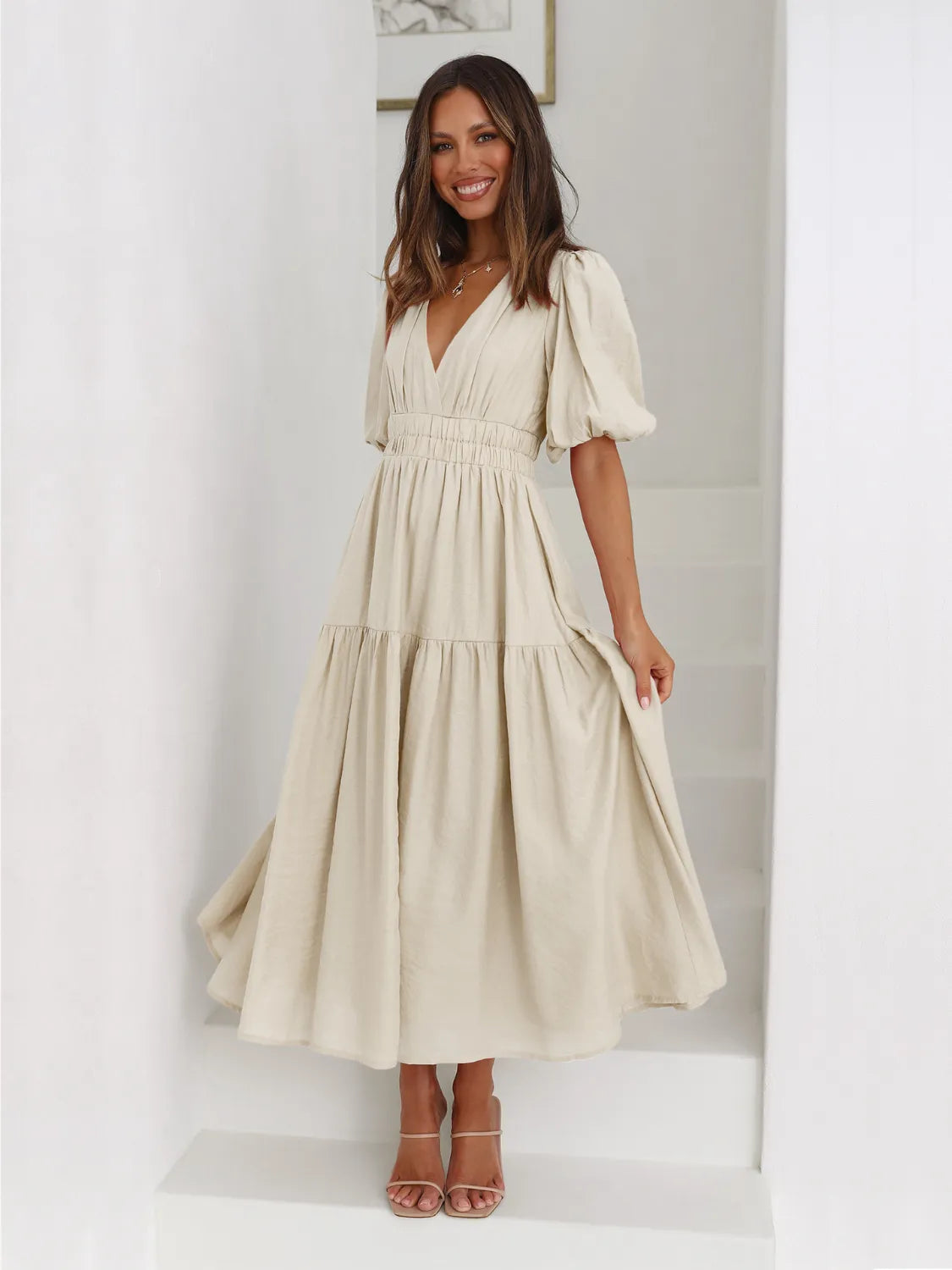 Beige tiered surplice midi dress with half sleeves and smocked waist for elegant spring wear