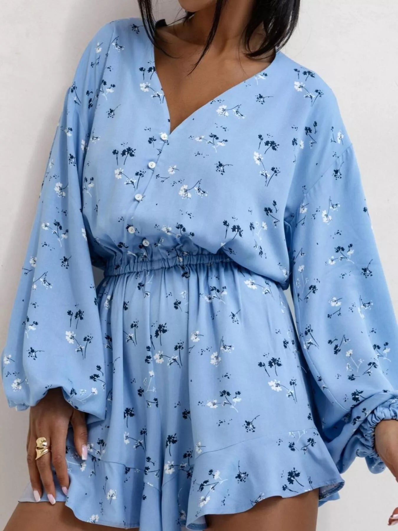 Floral V-Neck Long Sleeve Romper with buttoned ruffled sleeves and elastic waist in polyester fabric