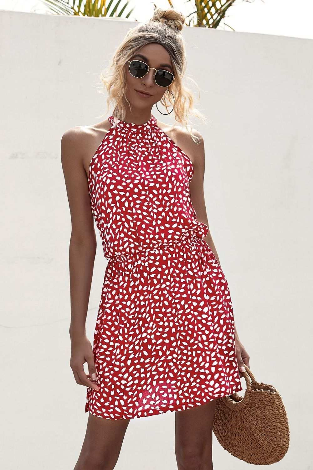 Chic printed Grecian neck mini dress with tie and sleeveless A-line design
