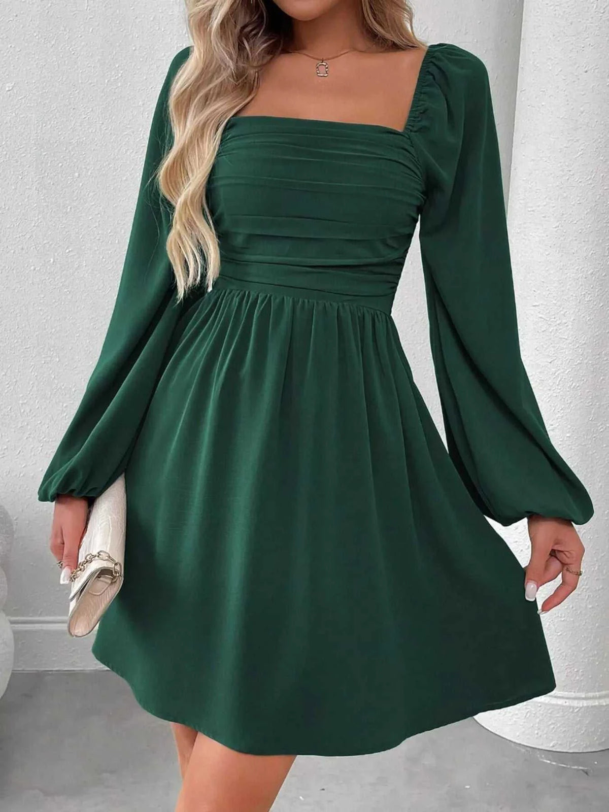 Ruched square neck long sleeve A-line dress in 100% polyester with smocked detailing and no stretch.