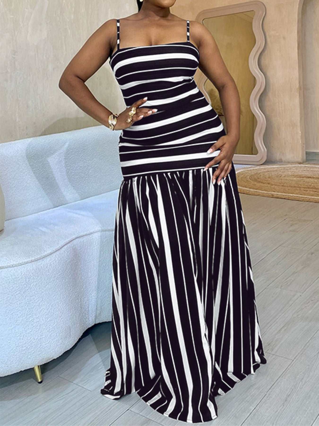 Plus size striped spaghetti strap maxi dress with slight stretch and polyester blend fabric