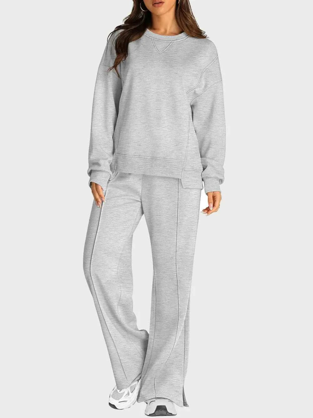 Two-piece round neck long sleeve top and slit pants set with pockets, 100% polyester, moderate stretch