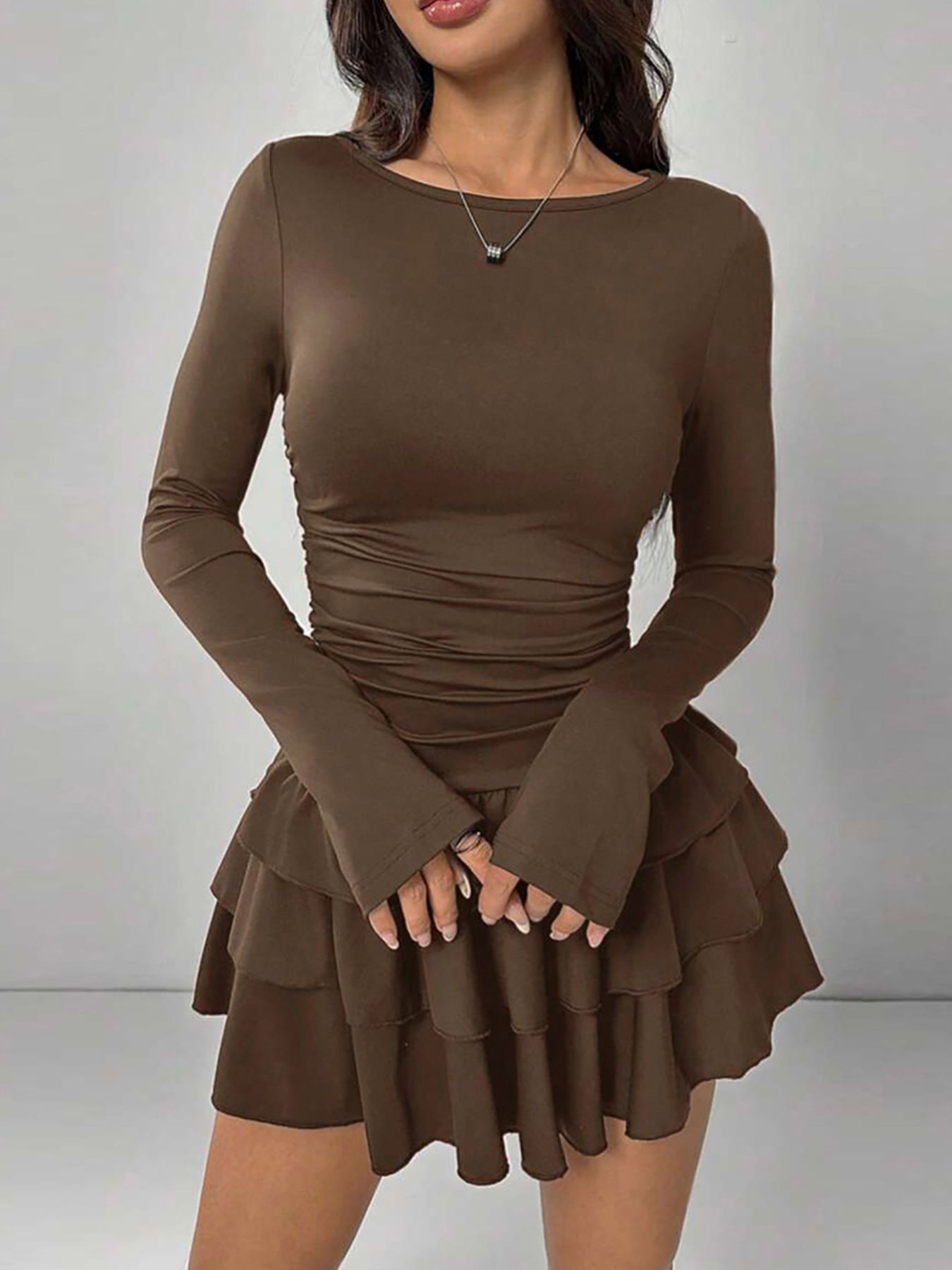Ruffle hem long sleeve mini dress with tiered ruffles and slightly stretchy fabric